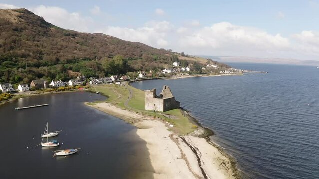 The Ruins Of Historic Kilchurn Castle And Jetty On Loch Awe, Argyll, Scotland