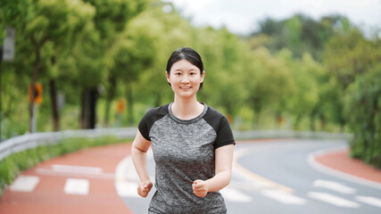 Active Young Woman Enjoying a Healthy Run Outdoors