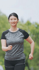 Confident Young Woman Enjoying a Healthy Run Outdoors
