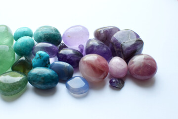 Multicolored healing chakra crystals. The stones are laid out in the shape of a rainbow. Real...