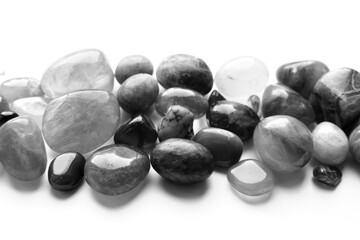 Healing chakra crystals, monochrome photo. Real semi-precious stones: rose quartz, amethyst,...
