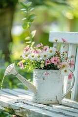 watering can and flowers in the garden. selective focus