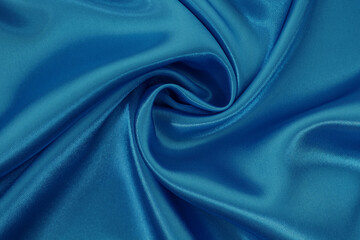 Dark blue fabric texture background, detail of silk or linen pattern.