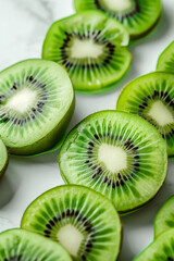 Fototapeta premium Kiwi slices on the table top down view full frame