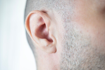 Close-up detail young male ear, showcasing intricate structure human hearing organ, Ear anatomy,...