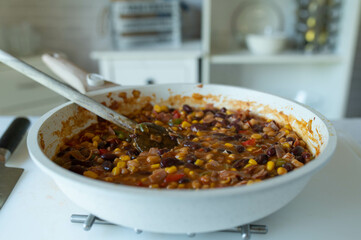 High protein tex mex pan dish with kidney beans, ham, baked beans and vegetables
