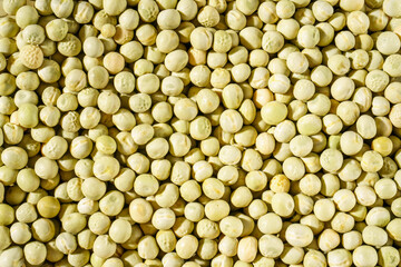 Background of a green peas grains close up. Food pattern.