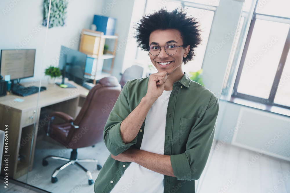 Sticker Photo of handsome cool assistant dressed khaki shirt glasses hand arm chin indoors workstation workplace