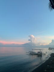 morning sun in Bali, Indonesia. Traditional fishing boats at Sanur Beach, Bali, Indonesia.
