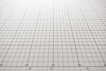 gray cutting mat board background with line and scale measure guide pattern for object art design,...