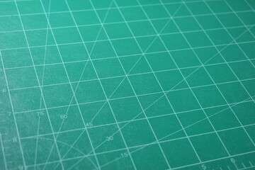 green cutting mat board background with line and scale measure guide pattern for object art design,...