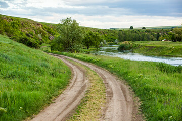 Beautiful summer landscape with green trees,  green meadows on the bank of the river in Republic of Moldova.