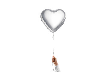 Hand holding blank silver heart balloon mockup, isolated © Alexandr Bognat