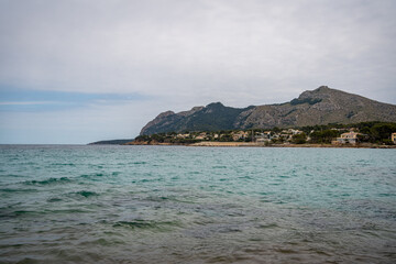 Fototapeta premium Rocky beach in the Victoria town in Mallorca Spain on a cloudy summer day