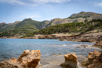sea side shore in la victoria town in mallorca spain on a chilly day - blue waters and blue sky