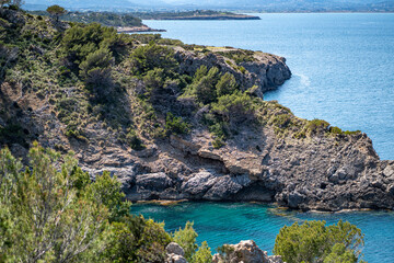 Fototapeta premium sea side shore in la victoria town in mallorca spain on a chilly day - blue waters and blue sky