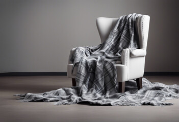laid silk blanket on a gray fabric armchair, isolated white background

