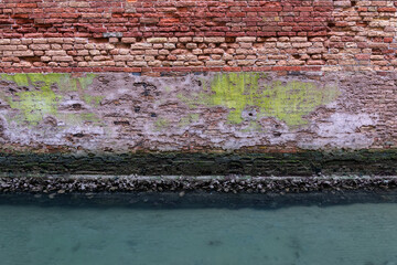 Old Weathered Wall At Canal In Venice