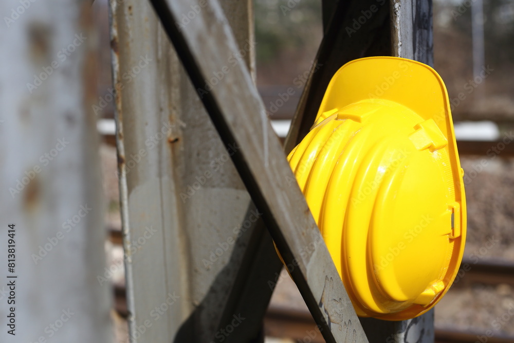 Wall mural yellow helmet on a work site