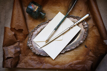 letter knife, quill and envelope