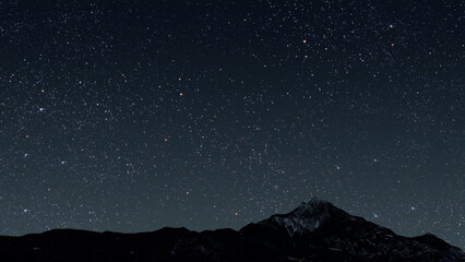 a a mountain. backgrounds night sky with stars and moon and clouds...