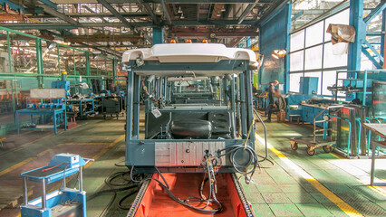 Conveyor assembly stage the body of tractor at big industrial factory timelapse