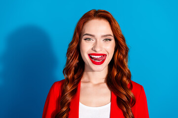 Photo of charming gorgeous girl wear red stylish clothes lick white teeth isolated on blue color background
