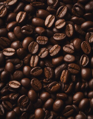 Naklejka premium roasted arabica coffee beans top view, dark wooden background, copy space for text 