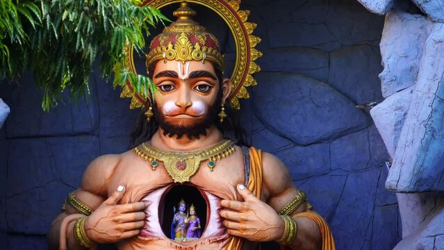 white statue of god Hanuman tears his chest