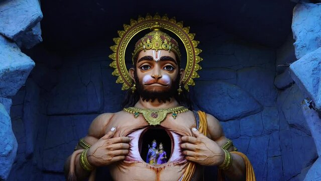 statue of god hanuman tears his chest