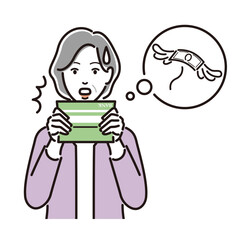 通帳を見て悩むシニア女性