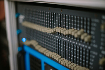 An audio mixer with its knobs and sliders meticulously adjusted, embodying precision and control in...