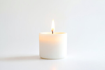 White Candle Burning on a White Background
