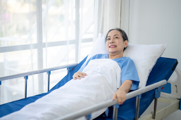 A woman in a hospital bed with a smile on her face