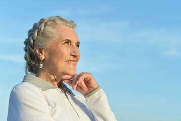 Portrait of a beautiful elderly woman outdoors