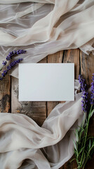 Elegant wedding invitation mockup with lavender flowers and sheer fabric on a wooden background