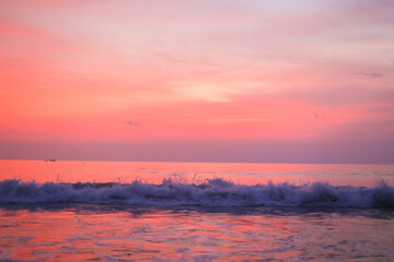 Beautiful peach sunset over the ocean. Peach Background of Sunset and Ocean Waves