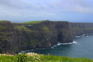 The world famous Cliffs of Moher are located on the west coast of the main island of Ireland in...
