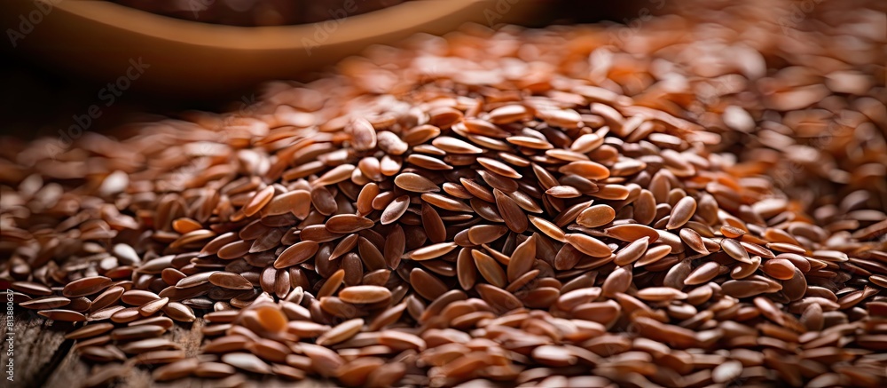 Poster copy space image with a natural background showcasing the texture and color of brown flaxseed which 