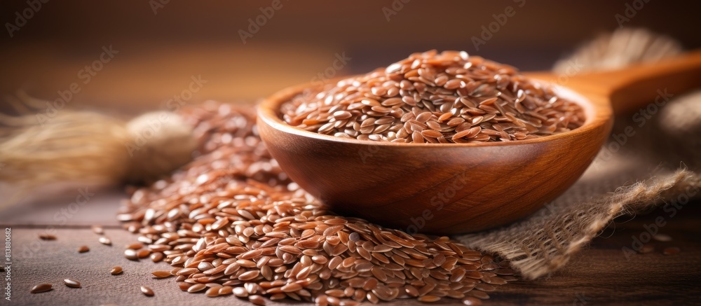 Poster copy space image with a natural background showcasing the texture and color of brown flaxseed which 
