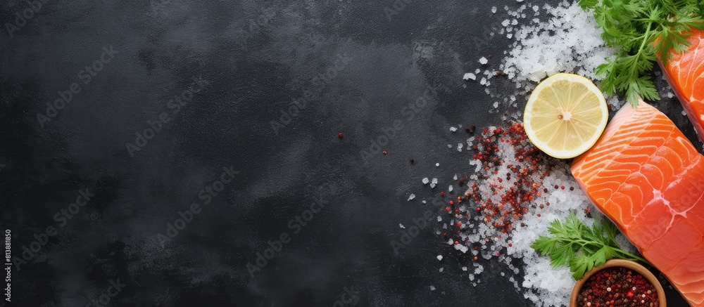 Poster a top view image of raw salmon fillet assorted salts and herbs placed on a grey concrete table backg