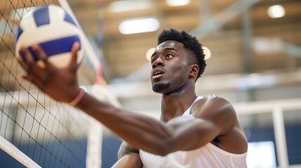 Black man practicing volleyball sport, person is focused and enjoying the sport, sports...
