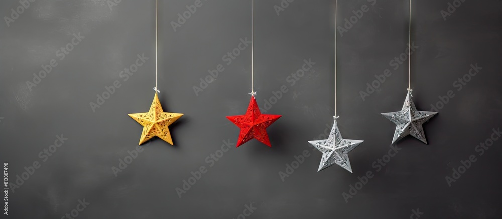 Poster festive felt christmas ornaments displayed on a grey background providing ample copy space for addit