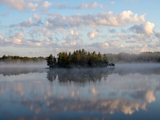 morning landscape with an island and fog