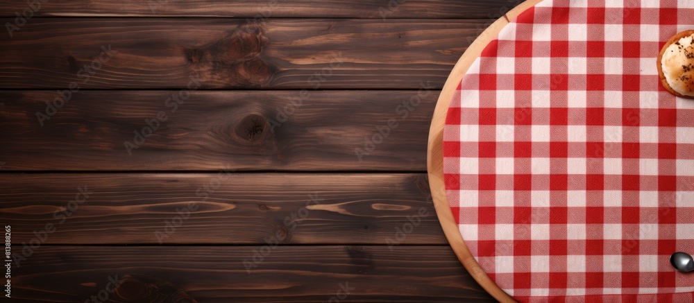 Poster top view mockup of an empty wooden deck table with a pizza board tablecloth napkin and copy space im