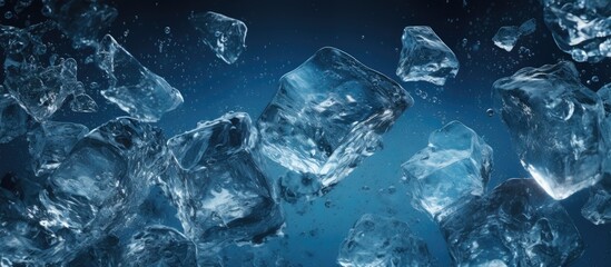 Close up of transparent ice cubes melting in dark blue water creating sparkling shards of ice crystals The copy space image showcases the beauty of melting ice in pure cold water during the spring se