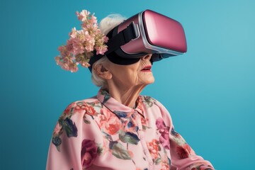 Elderly lady with vr headset adorned with flowers enjoys cutting-edge technology, contrasting age and innovation
