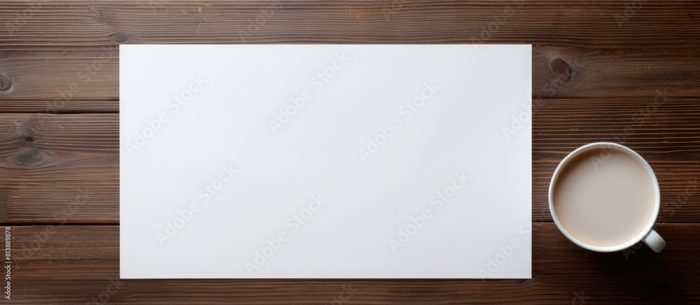 Poster top view of a wooden table with a blank paper brochure perfect for showcasing design with copy space