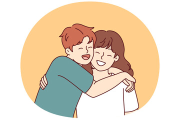 Positive little boy and girl hugging and laughing enjoying spending time together or summer vacation. Concept of happy childhood and friendship between classmates or little brother and sister
