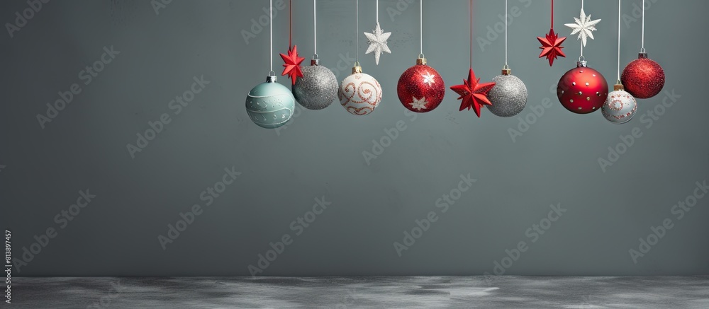 Poster festive felt christmas ornaments displayed on a grey background providing ample copy space for addit
